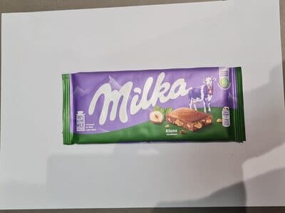 שוקולד מילקה שברי אגוזים 100 גרם